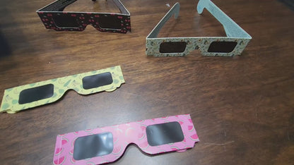 Demonstration of the four Tember fruit-design eclipse glasses