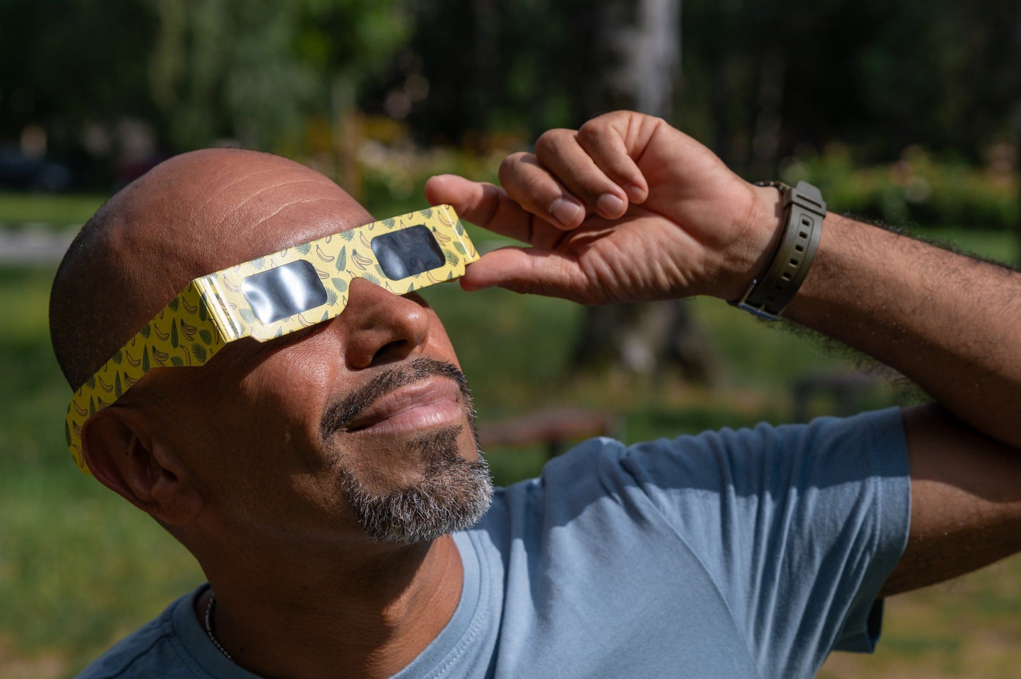 Close view of Tember Banana solar eclipse glasses being worn