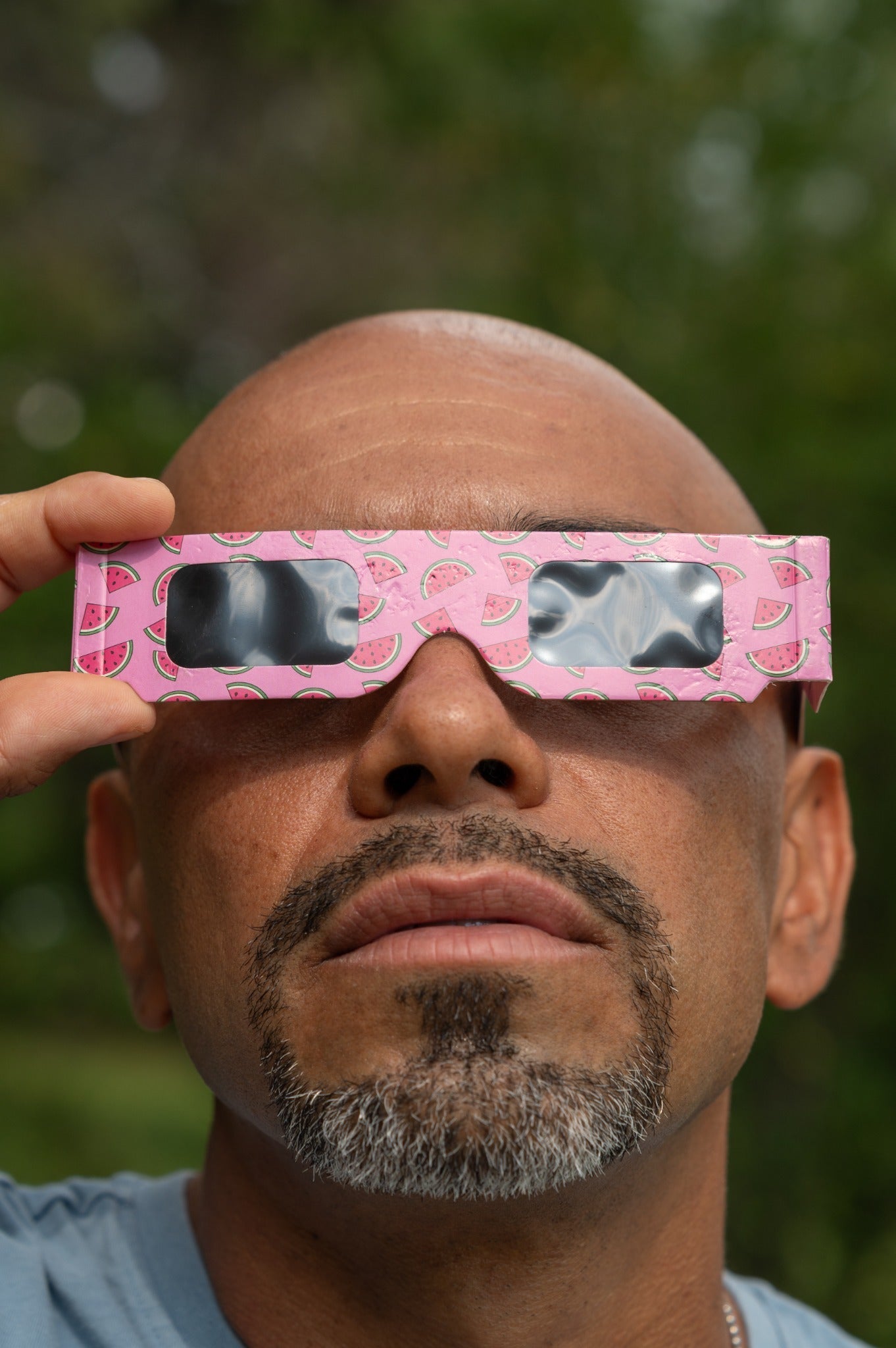 Close portrait wearing Tember Watermelon solar eclipse glasses